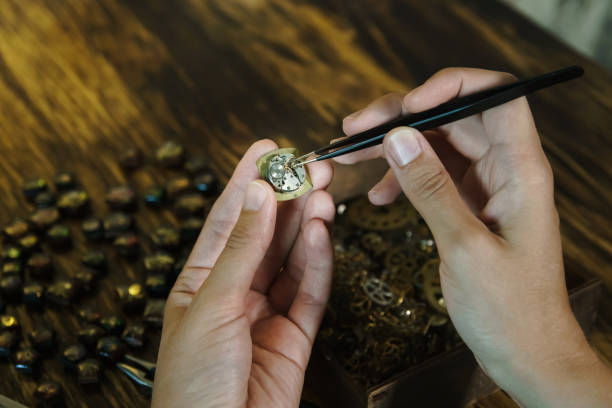 istock Girl craftsman dismantles watches. 1162020861