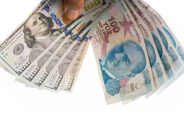 100 turkish liras and  dollars on white background