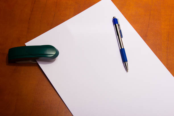 stapler and a sheet of paper