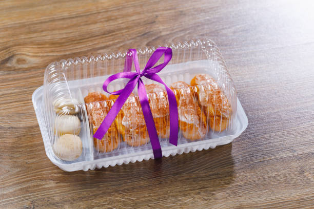 eclairs pastry in blister box, close-up view