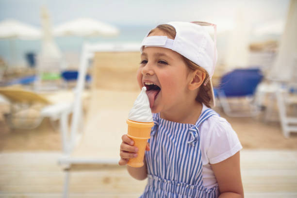 istock Girl imitating herself eating ice cream 1162029517