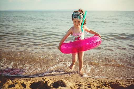 Cute girl having fun on a beach