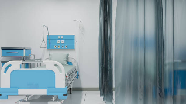 istock Single Patient Bed with Medical Equipment Inside a Recovery Room 1162032692