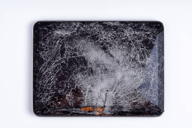 istock Tablet isolated on white background. The glass of the touchscreen is broken. 1162032889