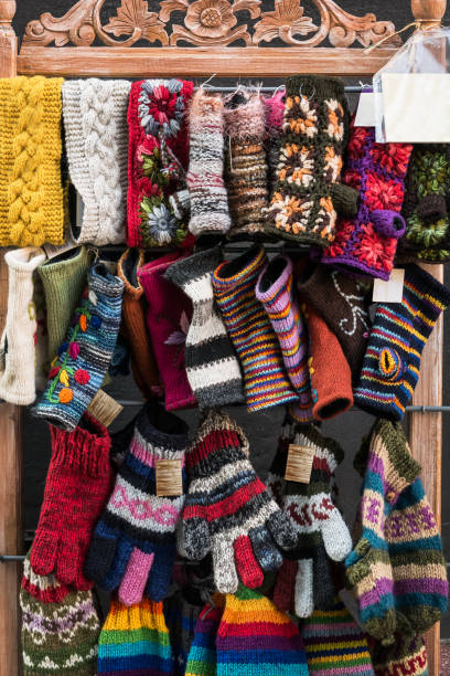 istock Colorful handmade knitted socks hang on the stand 1162034344