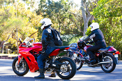Wollongong, Australia - July 10, 2019: Two bikers waiting for friends to start journey at Bulli Lookout NSW Australia