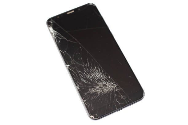 istock black phone with a broken sensor and screen, cracked touchscreen glass on a white background isloate 1162039233