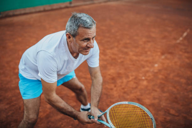 istock Senior man playing tennis 1162041737