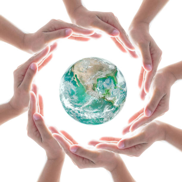 istock Collaborative people's hands surrounding globe world map for community empowerment concept. Elements of this image furnished by NASA 1162045266
