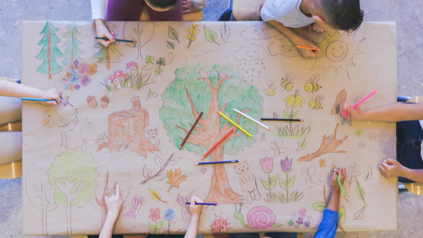 istock Kids draw mural celebrating nature 1162045323