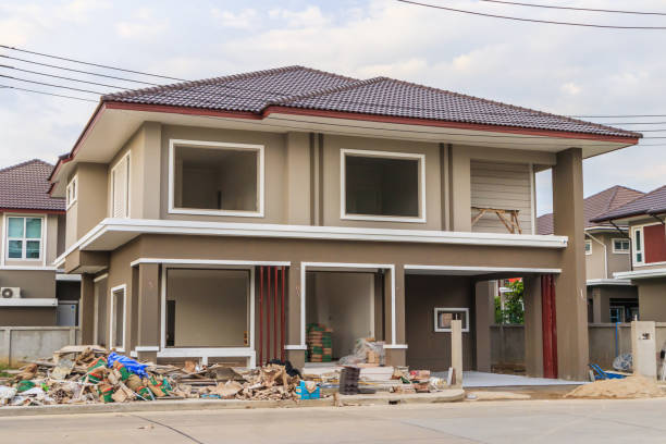 istock construction residential new house in progress at building site with clouds and blue sky 1162045325