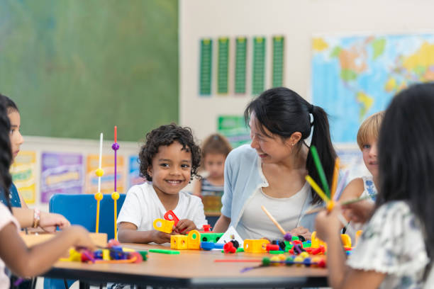 istock Young Asian Teacher Helps Her Student 1162045541