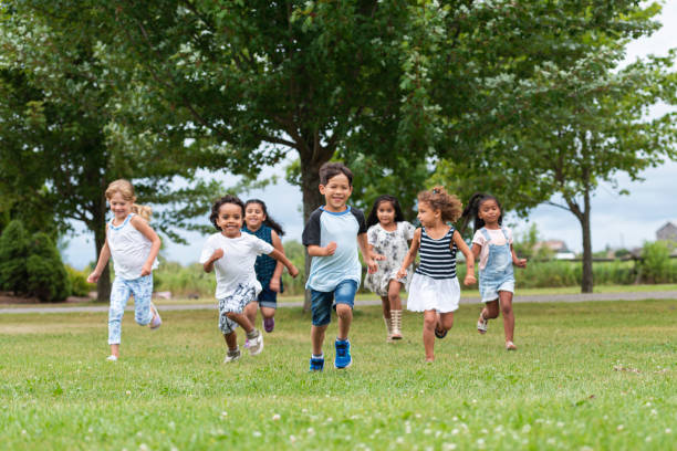 istock Cute Kids Running Outside in the Schoolyard 1162045552