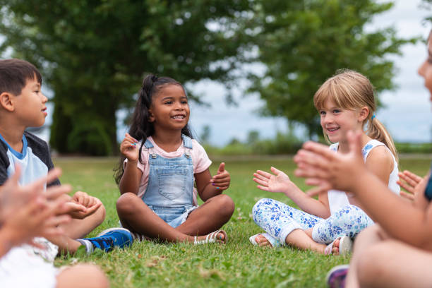 istock A Multi-Ethnic Group of Young Children are Clapping Outside 1162045560