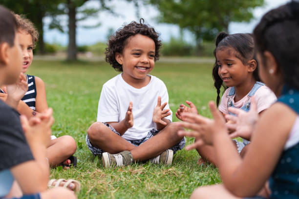istock A Multi-Ethnic Group of Young Children are Clapping Outside 1162045561