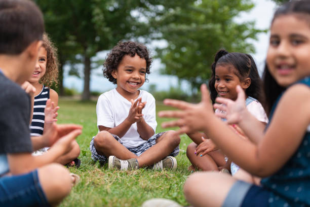istock A Multi-Ethnic Group of Young Children are Clapping Outside 1162045566