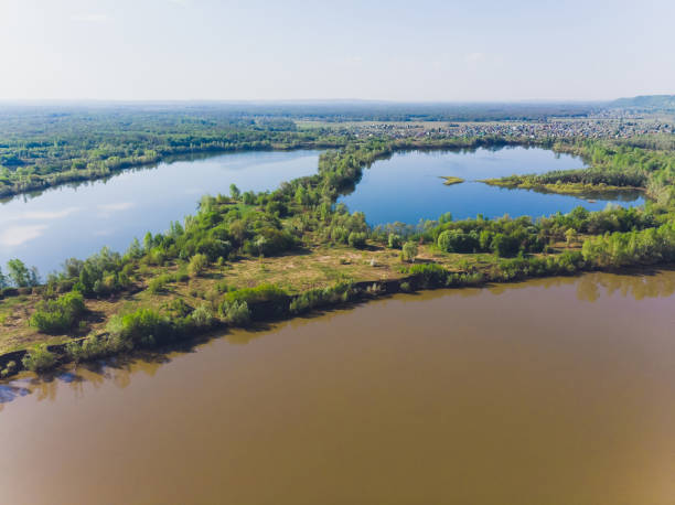 istock Field and river in summer, shooting from a quadcopter. 1162045733