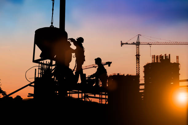 istock Silhouette of engineer and construction team working at site over blurred background for industry background with Light fair.Create from multiple reference images together 1162046063