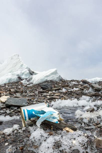 istock Garbage scattered over snowy mountain. Let's save the planet and recycle the excess garbage. 1162051936