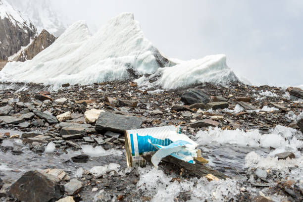 istock Garbage scattered over snowy mountain. Let's save the planet and recycle the excess garbage. 1162051951