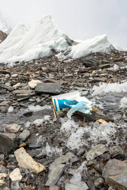 istock Garbage scattered over snowy mountain. Let's save the planet and recycle the excess garbage. 1162051983