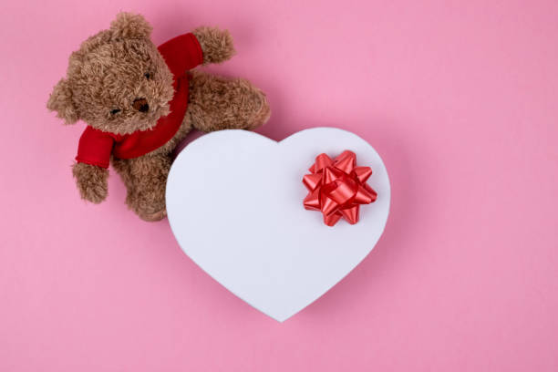 istock Teddy bear, white box hearts shaped, Valentines Day gift. Present for the christmas, thanks giving day, birthday holiday. 1162052757