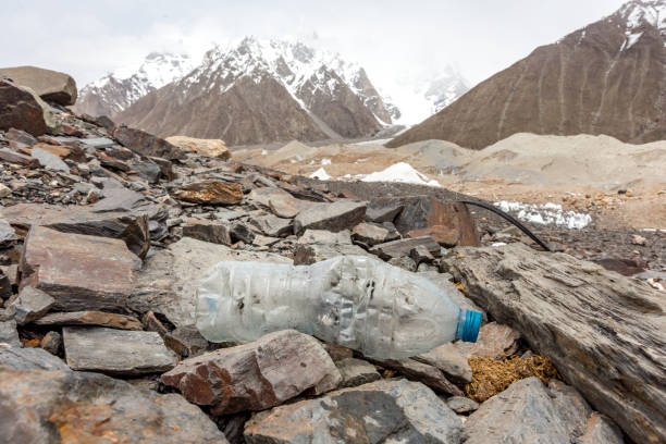 istock Garbage scattered over snowy mountain. Let's save the planet and recycle the excess garbage. 1162053308