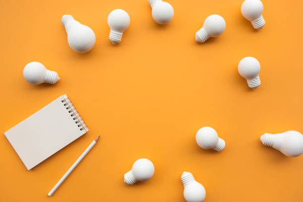 istock Creativity concepts with group of lightbulb and notepad on pastel color background 1162056336
