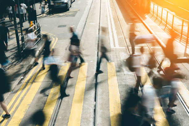 istock Pedestrian crossing at Busy City with sunlight 1162058621