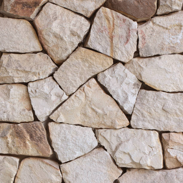 istock sand stone parts ,stone wall texture background 1162062024