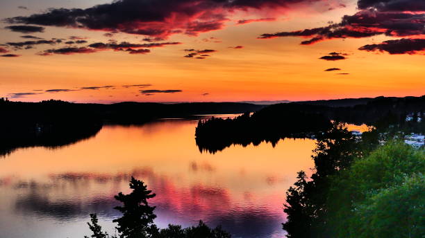 istock Island in bright orange sunset 1162062114
