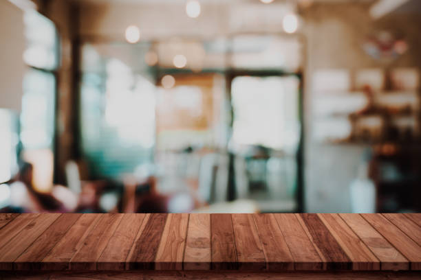 istock Empty wood table with blur cafe or coffee shop background. 1162062164