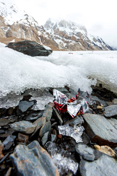 istock Garbage scattered over snowy mountain. Let's save the planet and recycle the excess garbage. 1162062952