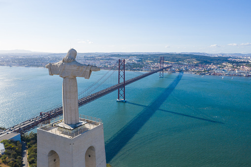 Lisbon, Portugal. June 7 2019: Aerial view of April 25th Bridge and Lisbon city.