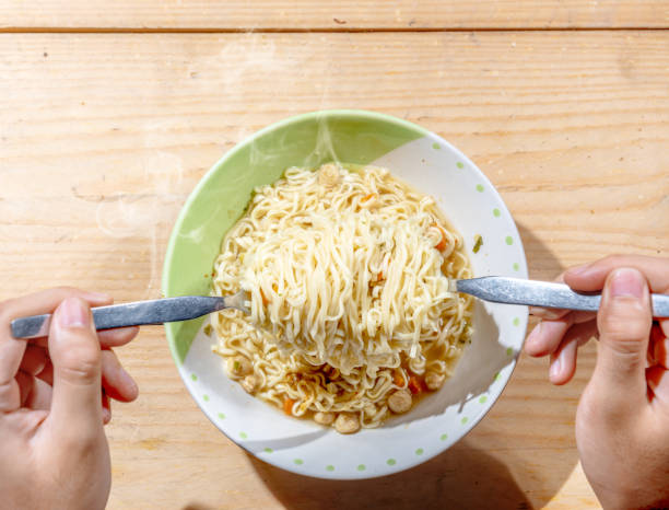 istock People eat the noodles with fork 1162064474