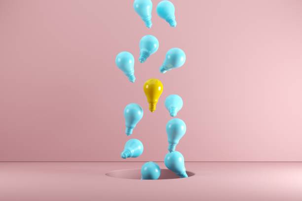 una lampadina gialla galleggiante tra le lampadine blu dal foro. idea concetto creativo. rendering 3d - nobody freshness variation individuality foto e immagini stock