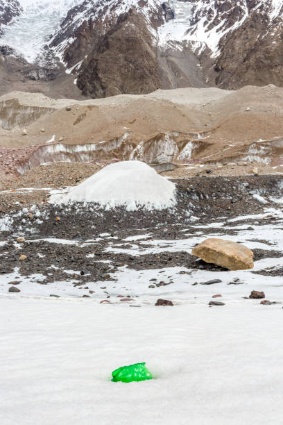 istock Garbage scattered over snowy mountain. Let's save the planet and recycle the excess garbage. 1162066082