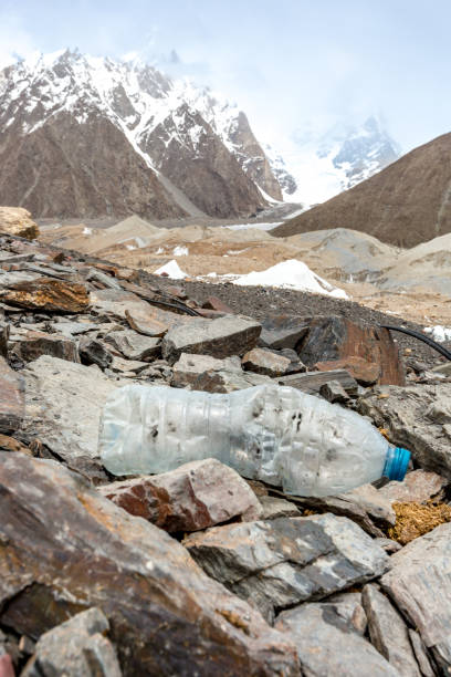 istock Garbage scattered over snowy mountain. Let's save the planet and recycle the excess garbage. 1162066277