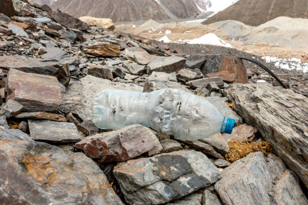 istock Garbage scattered over snowy mountain. Let's save the planet and recycle the excess garbage. 1162066313