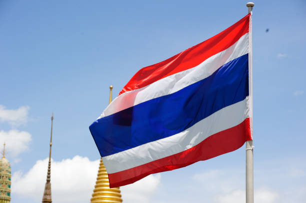 istock Thailand flag with Pagoda on blue sky 1162066466