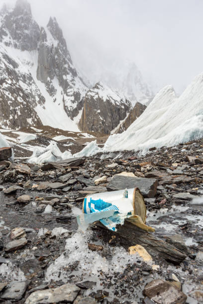 istock Garbage scattered over snowy mountain. Let's save the planet and recycle the excess garbage. 1162067434