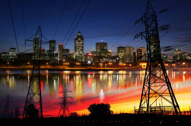 Urban Electricity Supply Lines Photo montage of two electric pylons over Montreal City buzbuzzer montreal city stock pictures, royalty-free photos & images
