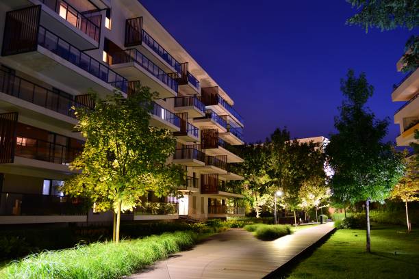 istock Exterior of apartment building at night 1162079256