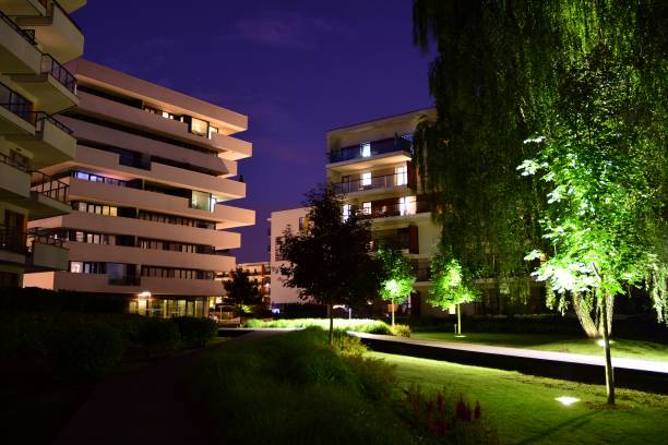 istock Exterior of apartment building at night 1162079328