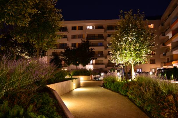 istock Exterior of apartment building at night 1162079383