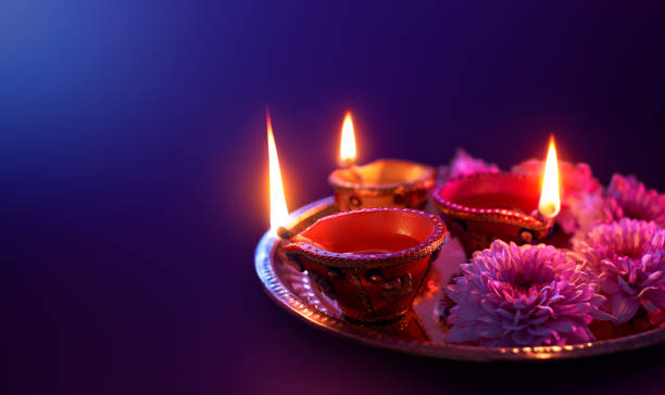 istock Colorful clay diya lamps lit during diwali celebration with copy space 1162080363