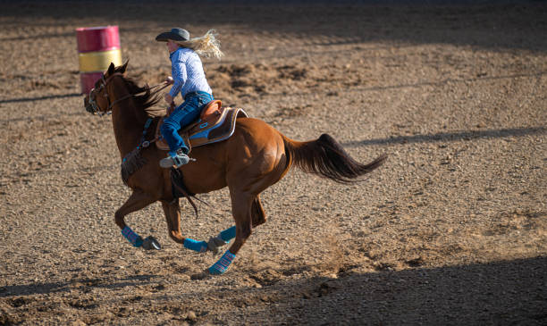 istock Young cowgirl barrel racing rodeo 1162080528