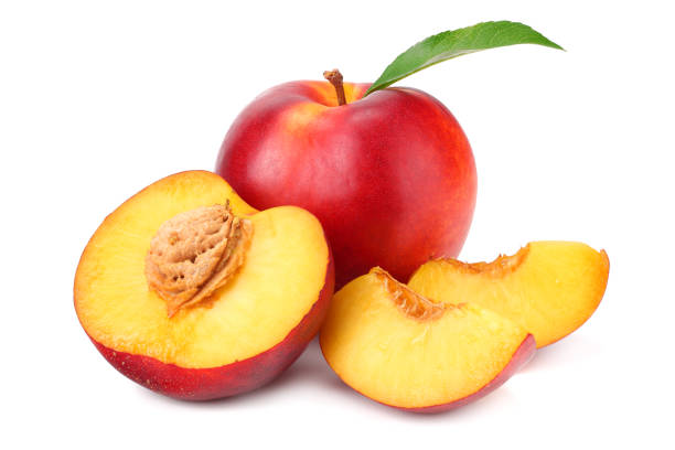 istock Nectarine with green leaf and slices isolated on white background 1162081337