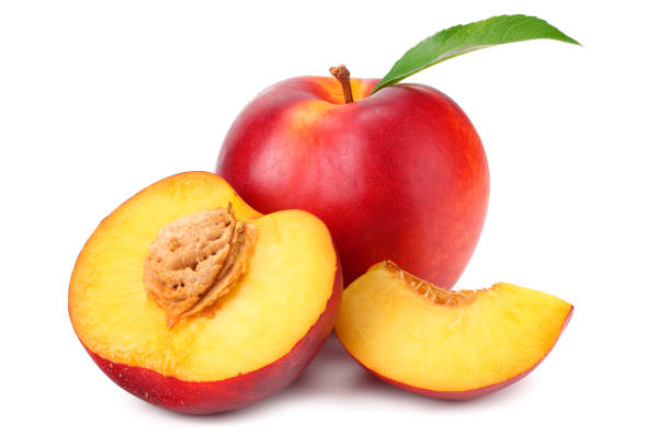 istock Nectarine with green leaf and slices isolated on white background 1162081375