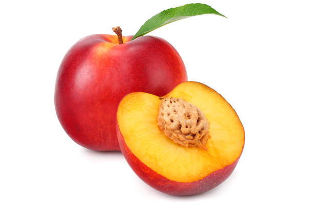 istock Nectarine with green leaf and slices isolated on white background 1162081389